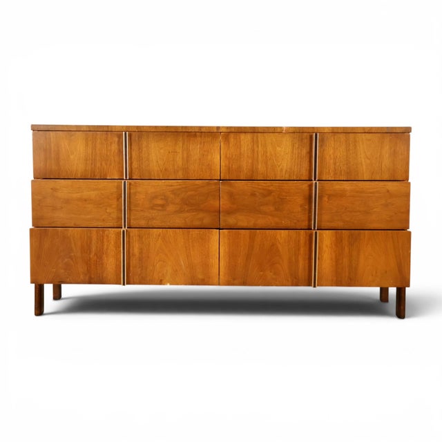 This 1960s John Widdicomb lowboy dresser carries the clean, architectural styling that defined the Grand Rapids maker's...