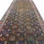 This antique Veramin runner from Central Asia showcases a refined and richly detailed allover floral design,...