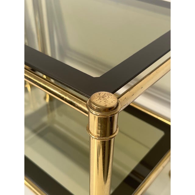 1970s 1970s Pair of brass side tables with smoked glass shelves For Sale - Image 5 of 10