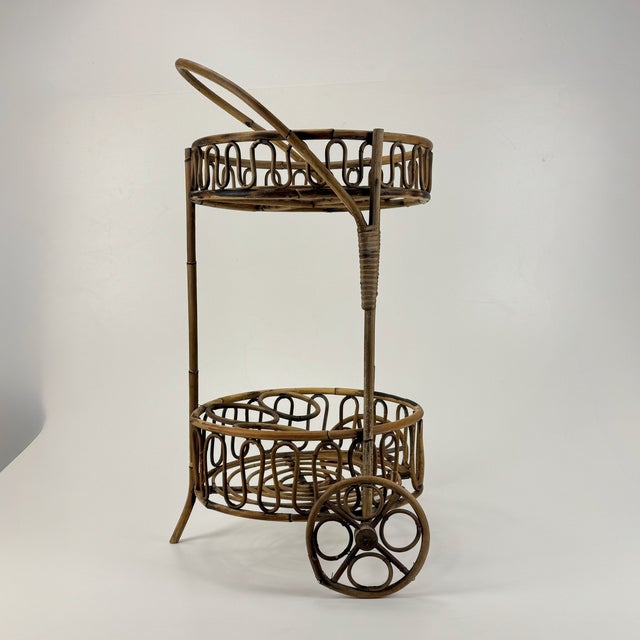 Vintage Bamboo Rattan Serving Bar Cart, Italy, 1950s, in Good conditions. Designed 1950 to 1959 This piece is designed in...