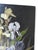 Early 20th century oil on wood painting of irises with a black background. Unsigned. Unframed, small scattered spots of...