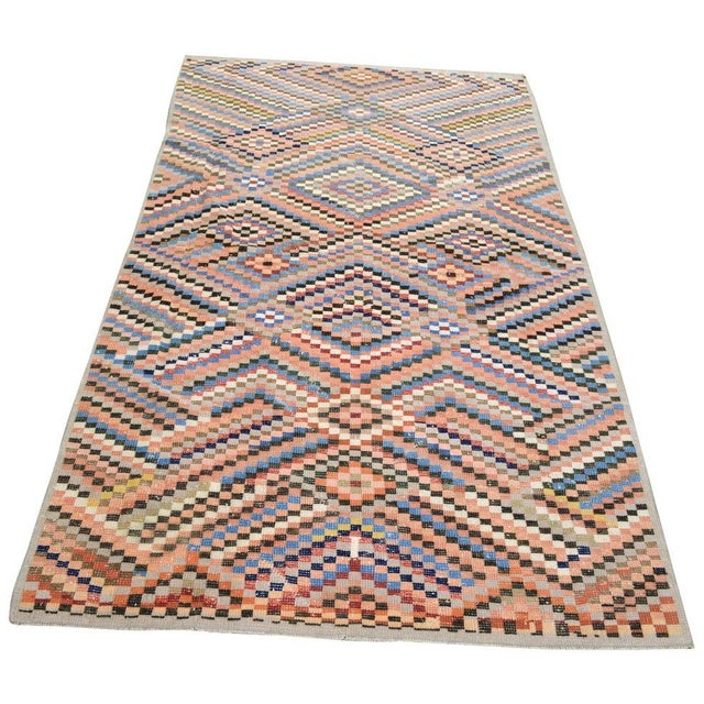 Hand-knotted with care using traditional rug-making techniques, this wool rug blends timeless craftsmanship with a modern...