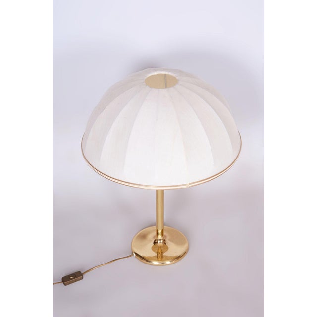 This table lamp is an elegant representative of 1960s czechoslovak design, part of the mid-century modern era. Its design...