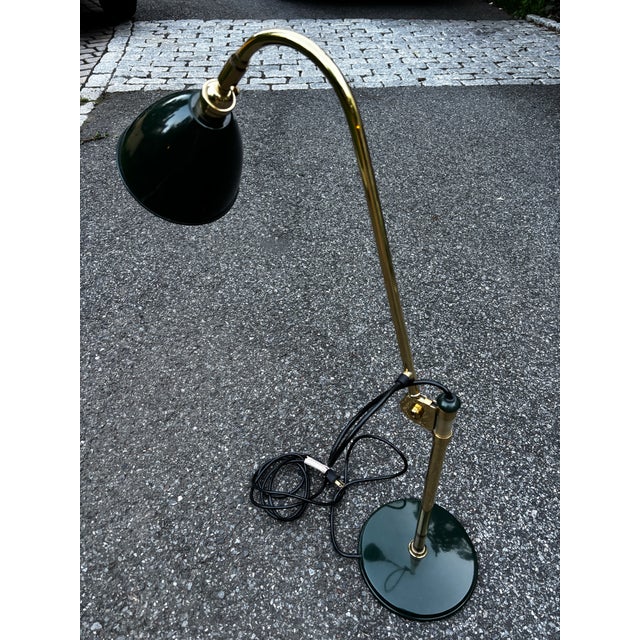 Beautiful Vintage drafting lamp by Louis Baldinger and Sons c. late 20th century featuring dark green painted sheet steel...