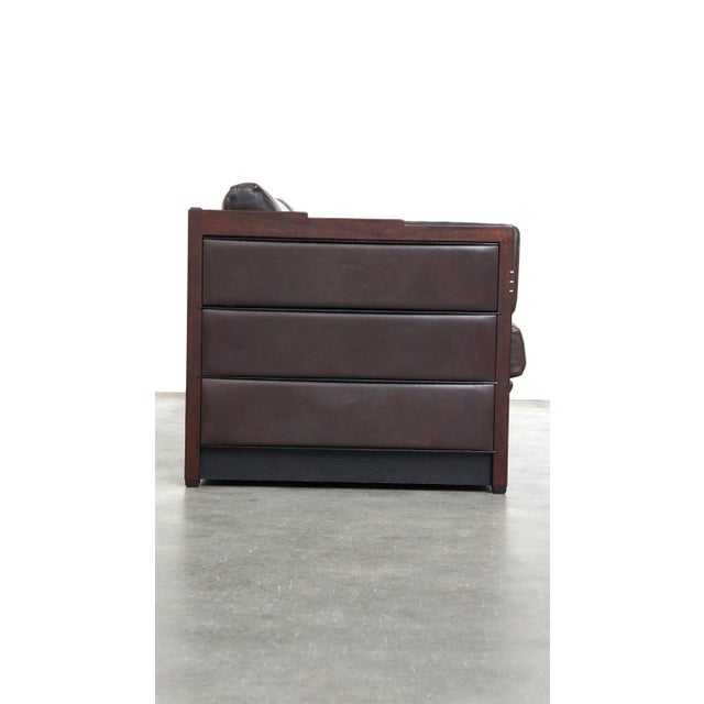 Offered is this Schuitema Art Deco leather 2.5 seater design sofa, model Baldwin, in a dark brown color. This design sofa,...