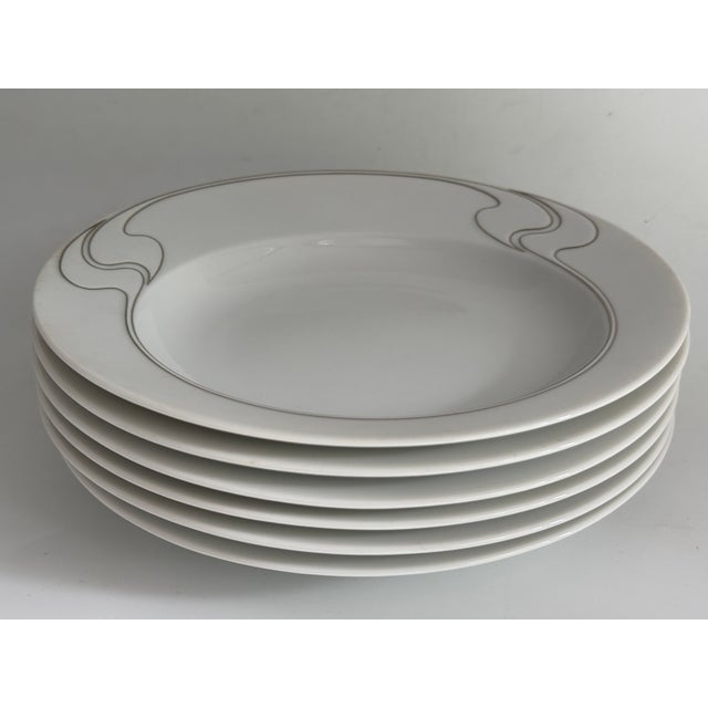Item: Soup plate 22.5 cm Manufacturer: Rosenthal Series: Asimmetria Decoration: White gold Material: Porcelain Condition:...
