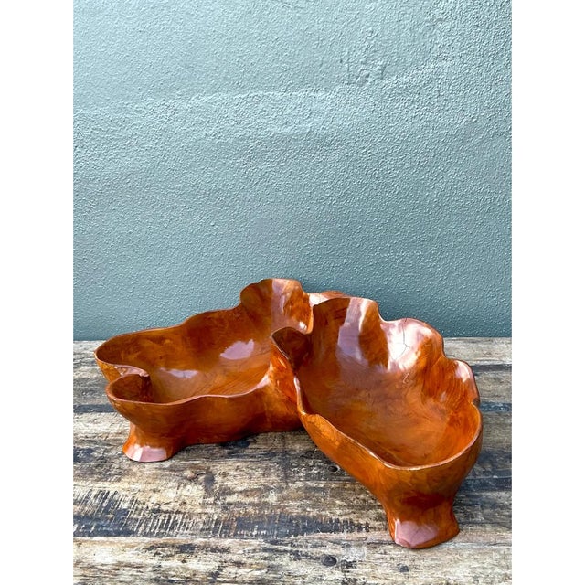 This vintage wood bowl is a large, free-form sculpture carved from a single burl-like piece of timber. It is built as a...