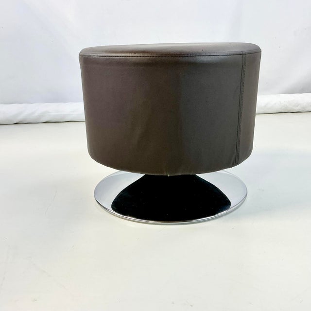 We love this low stool's design and function. The round stool cushion is a great shape and size. It swivels on its chrome...