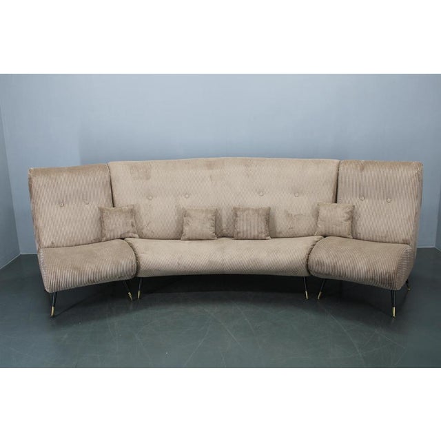 Rare curved modular sofa designed by gigi radice for minotti, italy, 1950s. This elegant mid-century seating ensemble...