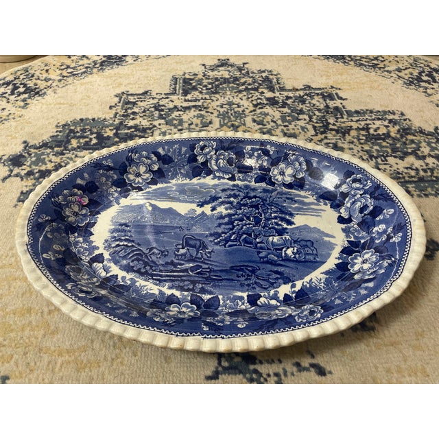 This exquisite W.C. Adams blue transferware ironstone platter, featuring the captivating "Cattle Scenery" design, is a...