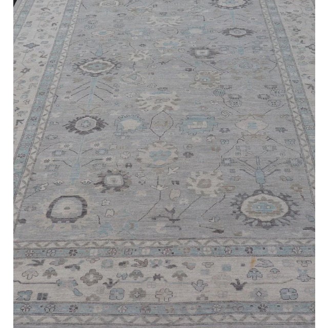 Measures: 13'4 x 19'3 Large Modern Oushak Design in Light Blue, Grey, with Light Cream Background. Keivan Woven Arts; rug...