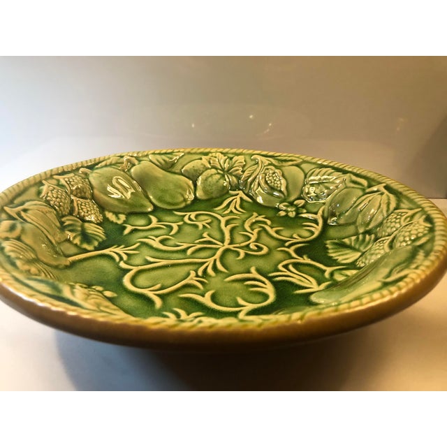This wonderul 1980s Green Majolica Pottery Fruit Bowl will be a standout on your kitchen counter or coffee table with its...
