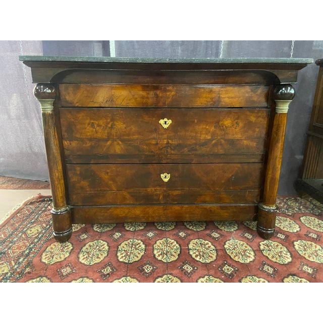 splendid early 19th century Empire chest of drawers with marble top This piece is attributed to the mentioned...