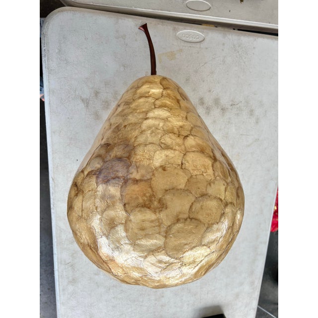 Beautiful large scale golden tone Capiz shell pear sculptural decorative object. A realistic rendition with a glossy...