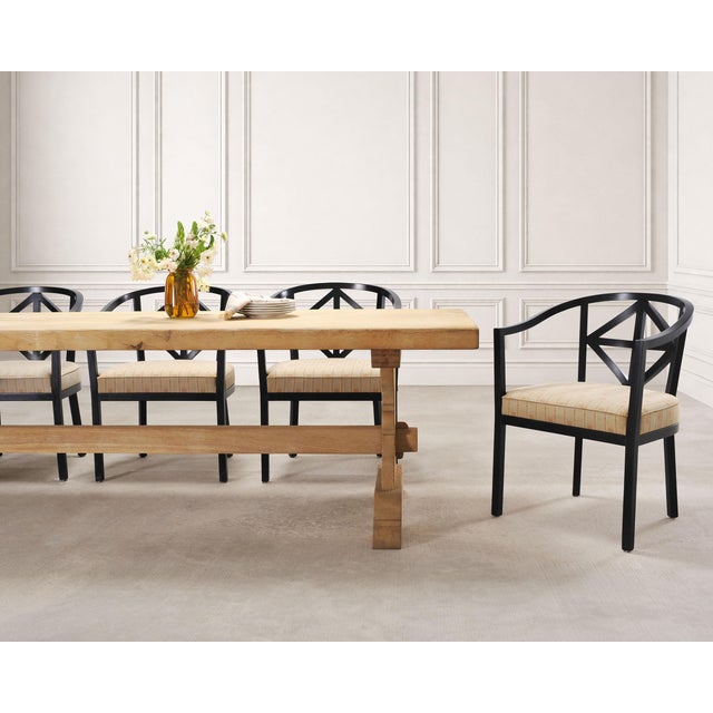 A grand 20th century French Country Provincial style farmhouse dining table featuring a bleached oak finish. The table is...