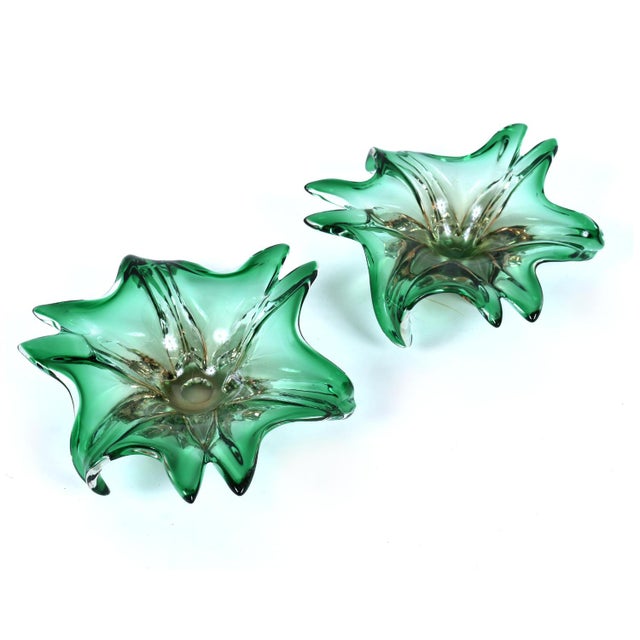 Pair of vintage 1960s emerald green and blush pink Murano glass dishes. The seemingly amorphic shape take on a botanical...