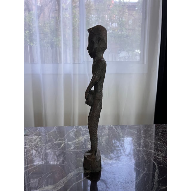 Beautiful hand carged African man sculpture. Great for any home decor. Purchased at an estate sale.