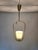 Exceptional vintage pendant light with an elegantly curved, sculptural brass frame. The delicate construction forms a...