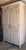 Pretty white non antique highly functional armoire pull out platform that swivels for a small TV or microwave.