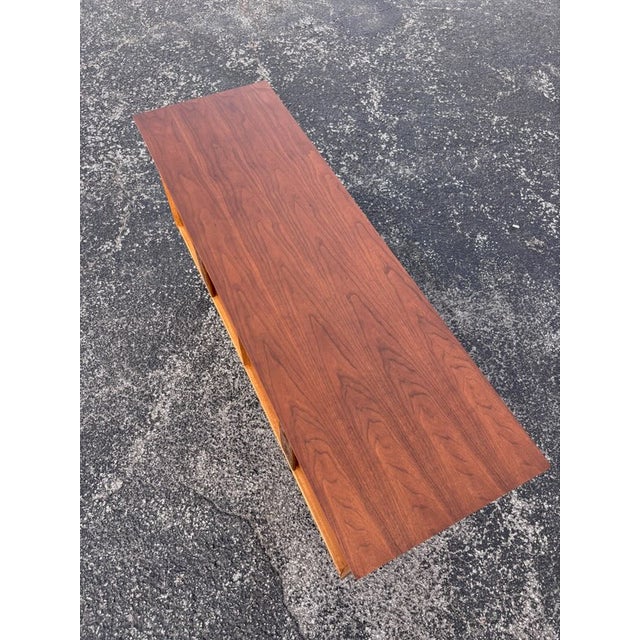 Refinished top to bottom and a new base constructed - sanded and stained to complement the case. The Aztec line is sought...