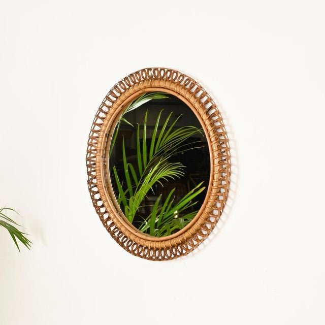 Stunning Mid-Century round mirror entirely crafted in bamboo, curved rattan, and hand-woven wicker. This charming organic...