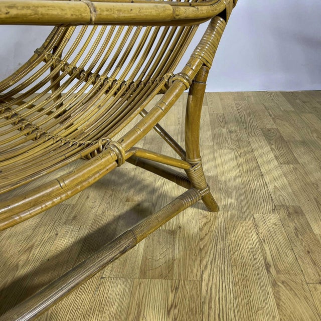 This high-back lounge chair perfectly embodies the mediterranean design of the 1960s, a golden age for the use of organic...