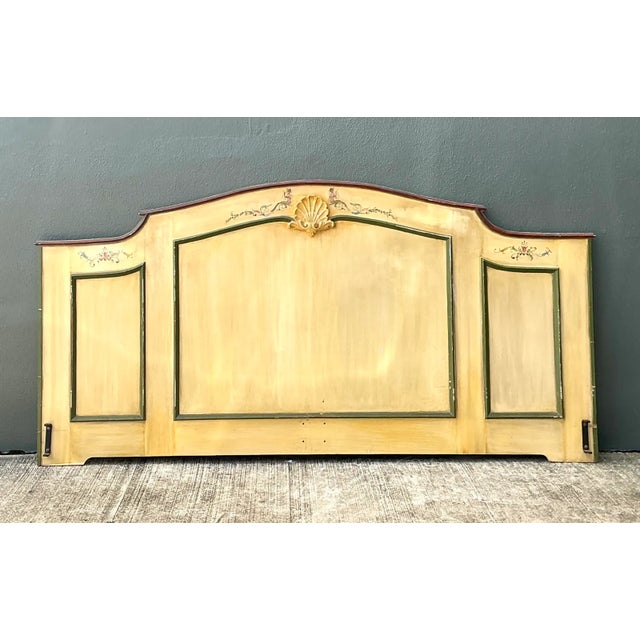 This vintage queen-size headboard is crafted from wood with a hand-painted finish that highlights its decorative,...