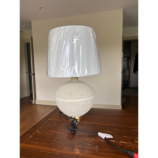 New in original packaging! Textured ceramic lamp with gold leaf accenting at base and finial. Sturdy, well-made piece adds...