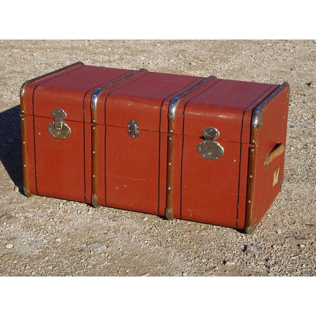 Storage trunk, originally a cabin trunk for transporting personal belongings during train or boat travel. This early 20th-...