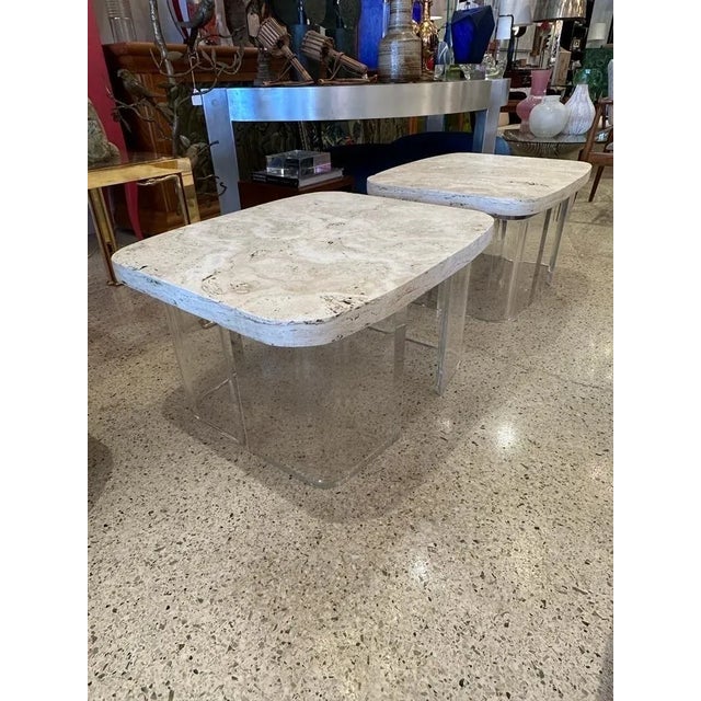 This pair of thick (2 inch top) and heavy natural infilled travertine stone slabs on top of sturdy curved shape Lucite...