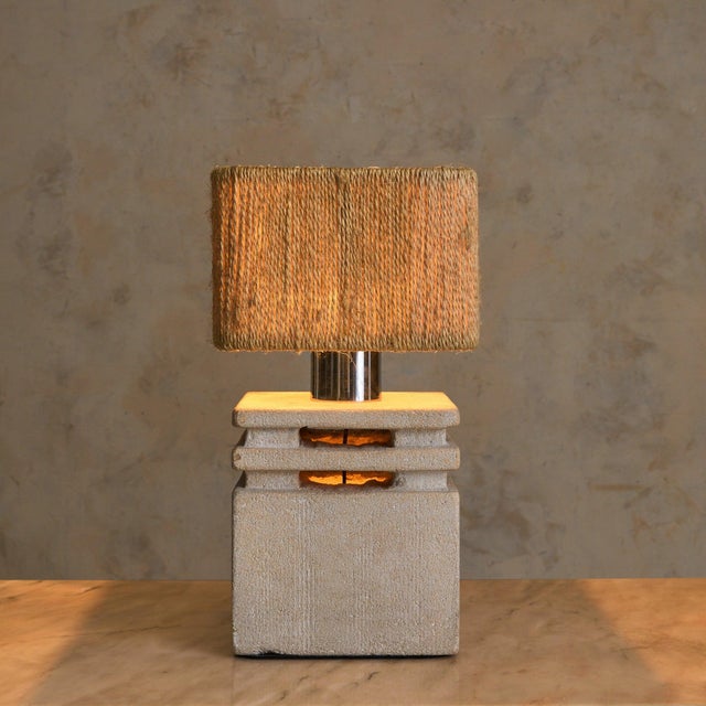 A French table lamp by Albert Tormos, hand-carved from solid limestone in the 1970s. The form is defined by stacked...