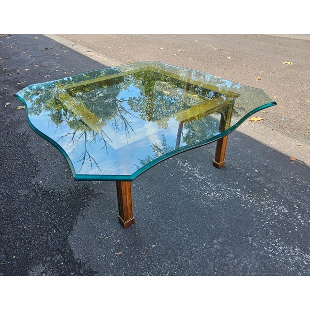 A Stickley contemporary Chippendale Walnut and tempered and Ogee glass top cocktail / coffee table. Measures 38" in width,...