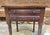 This early American or Sheraton accent table stands as a testament to early 19th century craftsmanship. Featuring a...