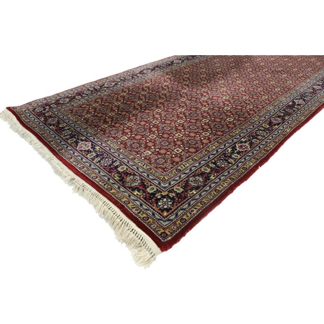 Vintage Persian Style Hallway Runner with Tabriz Design 02'07 x 08'00. This hand-knotted wool vintage Persian style carpet...