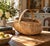A generously scaled late-19th-century gathering basket, handwoven from narrow oak splints around a sturdy fixed bentwood...