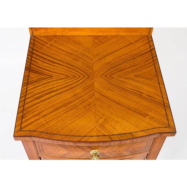 A beautiful antique Victorian bowfront satinwood bedside cabinet, circa 1880 in date. This superb piece features...