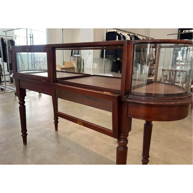 Gently used display case in an understated antique style with gorgeous bow end cabinet. The cabinet is constructed of...