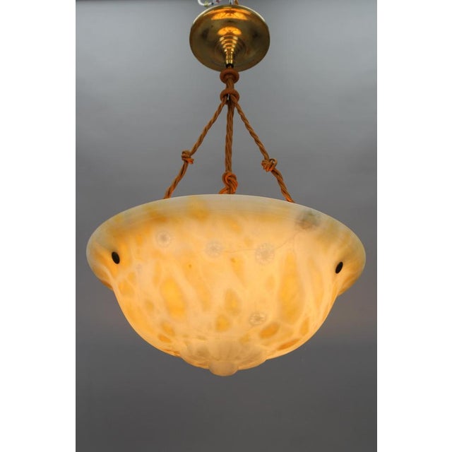 - A magnificent Art Deco warm cream color alabaster pendant ceiling light fixture. - France, circa the 1930s. - This...