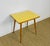 Vintage coffee table dating from the 1960s. Rotating and detachable top. Yellow Formica top. Charming side table, vintage...