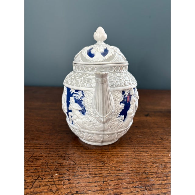 Schafer and Vater, better known for their matte bisque finish Jasperware, created a “wiped” glaze line of porcelain with a...