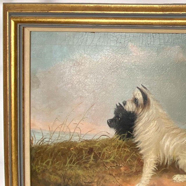 DETAILS An antique oil on canvas painting of a Scottish Terrier and West Highland white terrier dog seated in profile on...