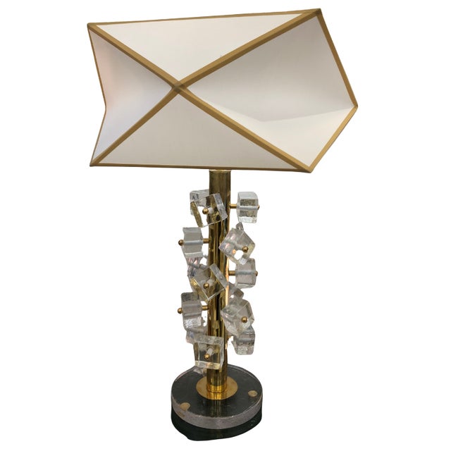 Pair of Murano glass table lamps, handcrafted in Italy. These lamps feature a slender, elongated body with Murano glass...