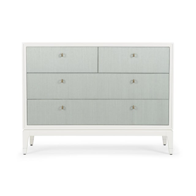White painted cabinet with four light aqua abaca front drawers featuring brass pulls. Not intended for clothing storage.