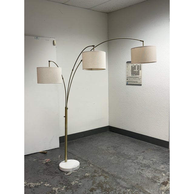 Design Plus Gallery presents the Locke Three-Arm Marble Arc Floor Lamp from Pottery Barn. This contemporary floor lamp...