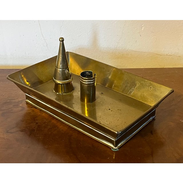 Antique 19th century American brass candle stick holder with snuffer. In the form of a rectangular footed tray with an...