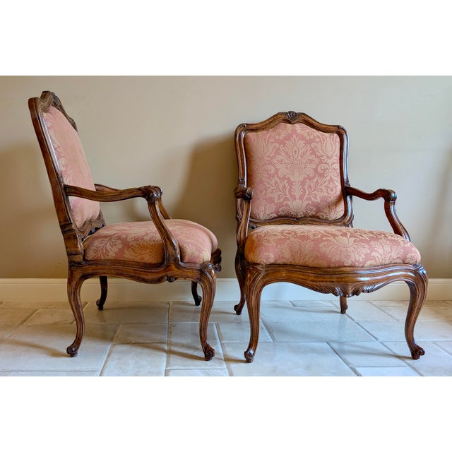 Gorgeous set of chairs in a warm walnut finish with high-end damask upholstery.