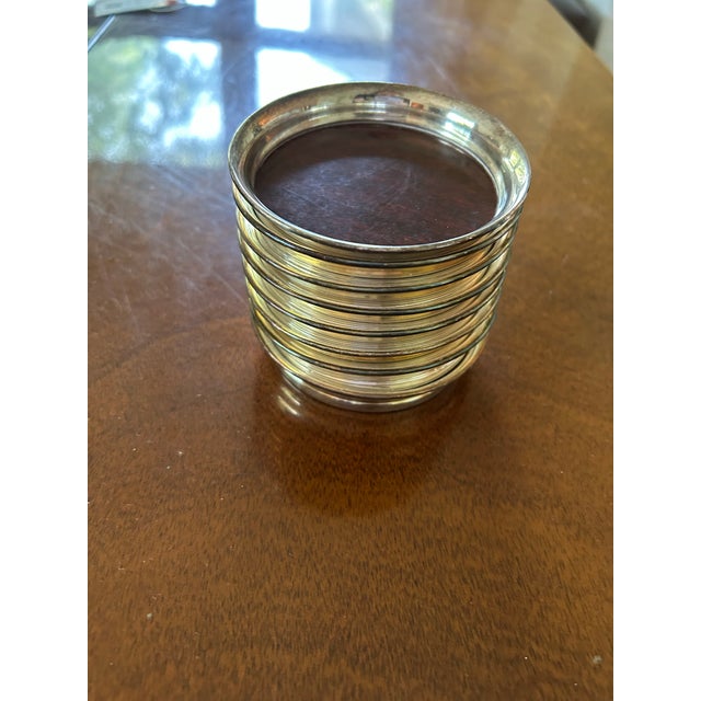 The MCM Drink Coasters are a set of 8 3.5" round coasters featuring a unique silver patina trim design, perfect for adding...