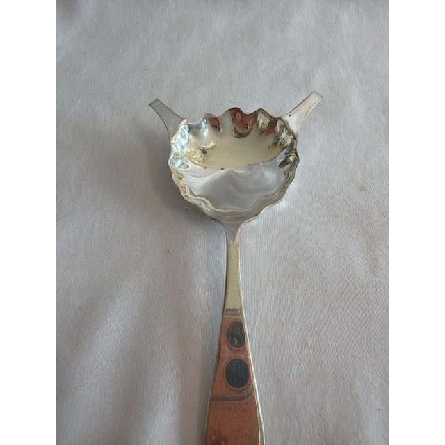 Vintage Reed & Barton Silverplate Brandy Warmer / Cognac Spoon. This elegant barware accessory features a scalloped shell-...