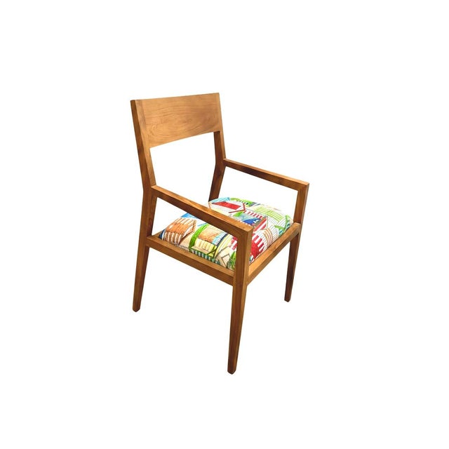 Refine your space with this elegant set of two mid-century modern teak chairs, crafted from premium teakwood with a warm,...