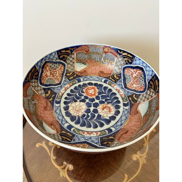 Japanese Imari Porcelain Bowl, measurements for just the bowl: H: 5" and Dimension/top: 12.5" . Design is a typical...